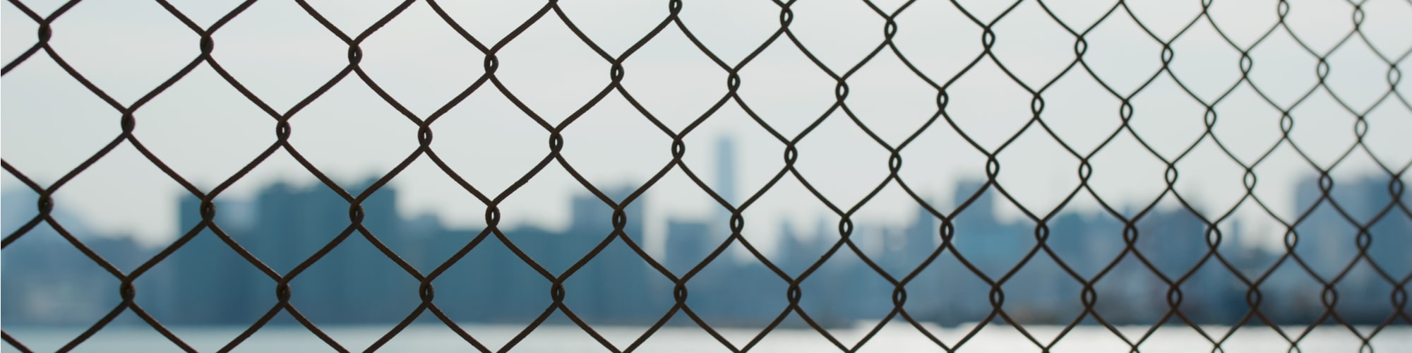 Chain link fence in city