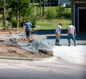 Residential crew pouring concrete for a new concrete project.